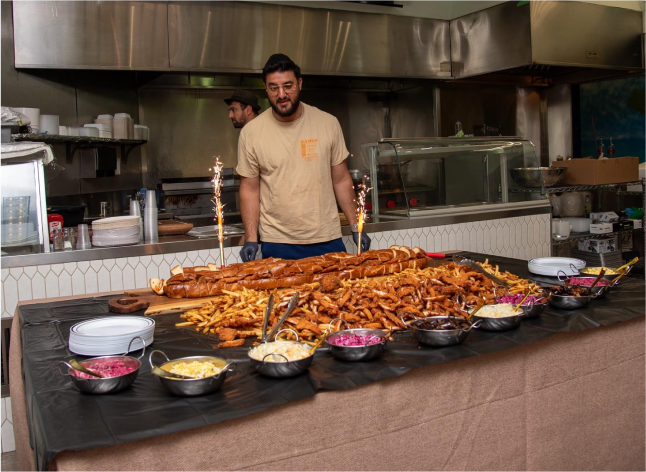 A celebratory feast at Kapara — flame-grilled meats, loaded fries, and fresh mezze