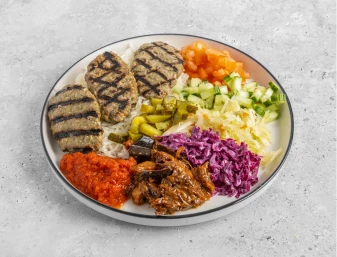 Kebabs sizzling on the open flame grill